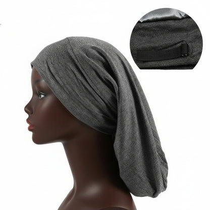 Satin lined long nightcap protecting braids and long hair
Adjustable sleep cap for dreadlocks and thick hairstyles
Woman wearing satin bonnet for frizz-free overnight hair
Long hair nightcap with secure comfortable fit