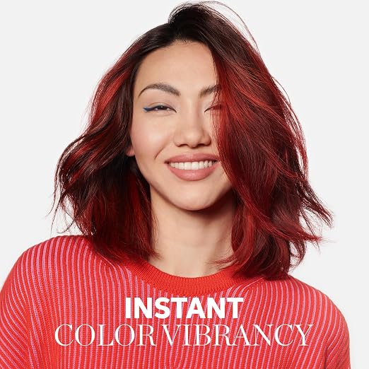 Woman with red hair and a red sweater, with 'Instant Color Vibrancy' text.