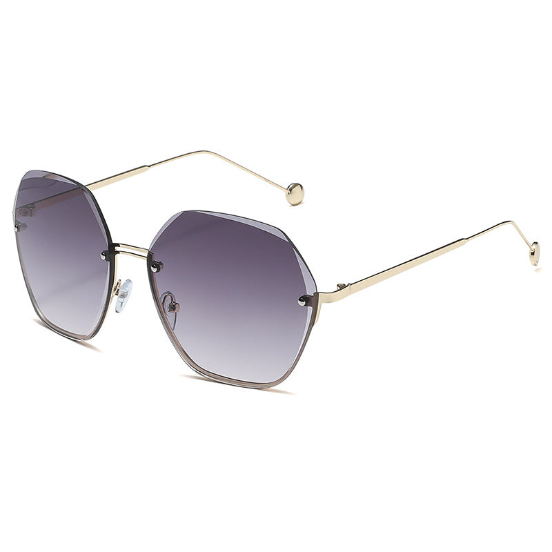 Sunglasses with gold frame and gradient purple lenses on a white background
