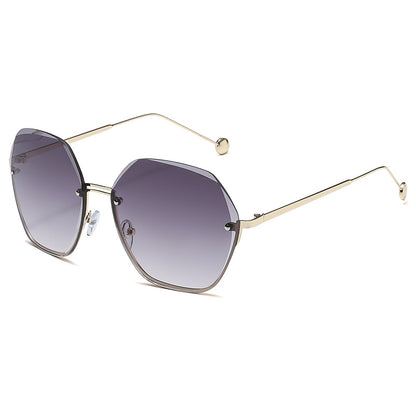 Sunglasses with gold frame and gradient purple lenses on a white background